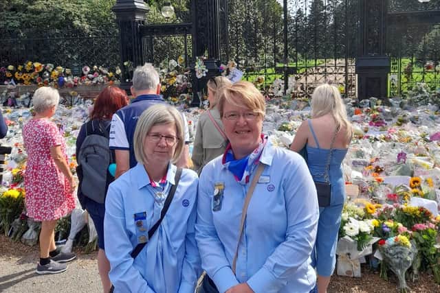Sarah Ellis (right), District Commissioner for Burgh Skegness and Spilsby, and 1st Spilsby Brownie leader Diane Wilson-Dakin went to Sandringham Estate to see the floral tributes with other members.