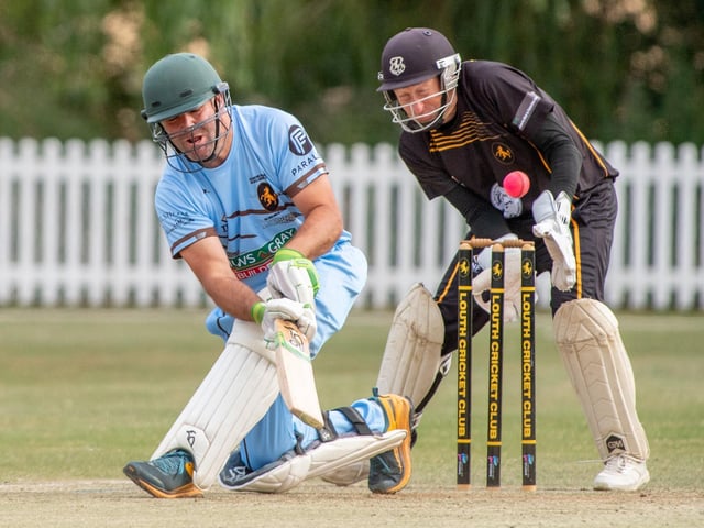 Martin Dobson, Lincolnshire Cricket's Chief Executive) playing for England team and Louth CC wicketkeeper Graham West.
