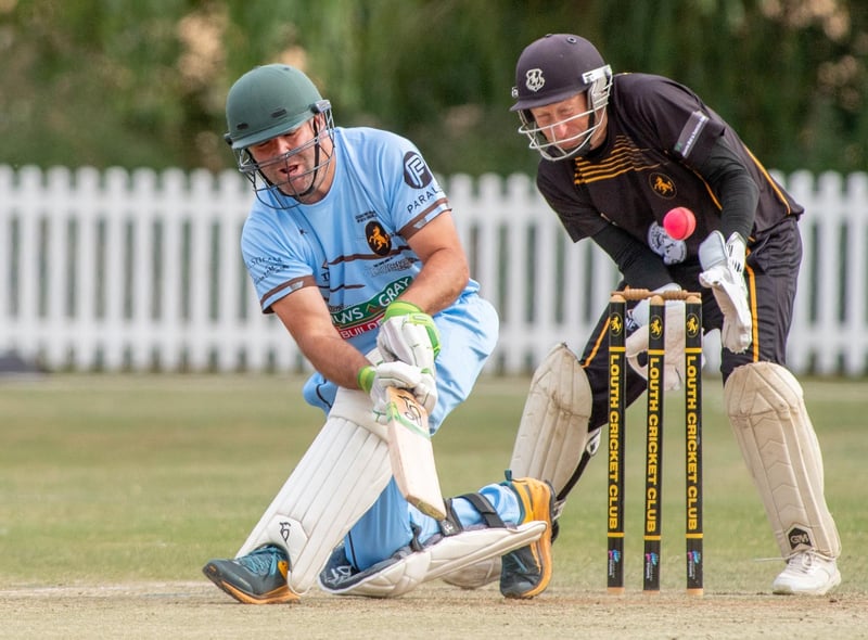 Martin Dobson, Lincolnshire Cricket's Chief Executive) playing for England team and Louth CC wicketkeeper Graham West.