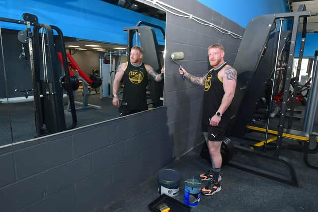 Iron Eden co-owner, Tim McGibbon, giving the gym a makeover.