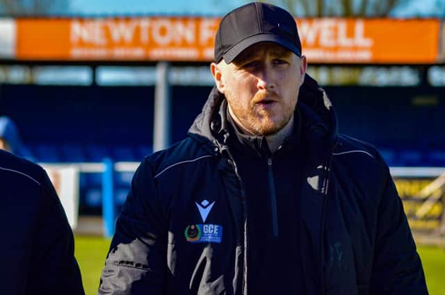 Manager Chris Funnell debriefs his squad on the pitch after the 2-0 victory! - (Joshua’s football photography)