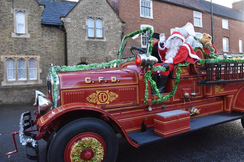 Peter Ingall of Rand bringing Santa to Wragby Christmas Market on his vintage American fire engine