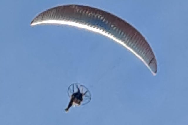 This glorious shot of a paraglider, flying beneath a beautiful blue sky, over Thorseby Hall, was snapped by Janet Hughes.