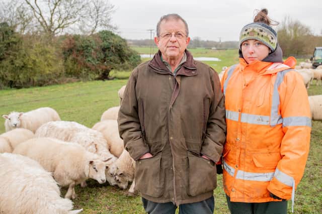 George Robinson and  Keira Rhodes with their flock of sheep. Photo: John Aron Photography