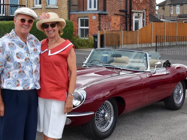 This well-dressed couple arrived at the festival in style -- by classic car.