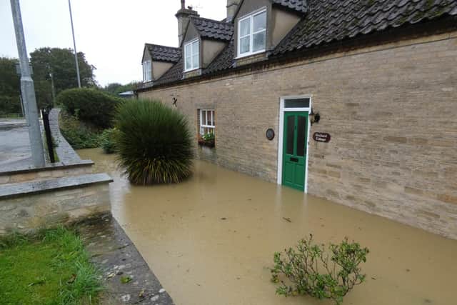 Floodwaters at the cottage on Holdingham Lane. Photo: Robert Oates