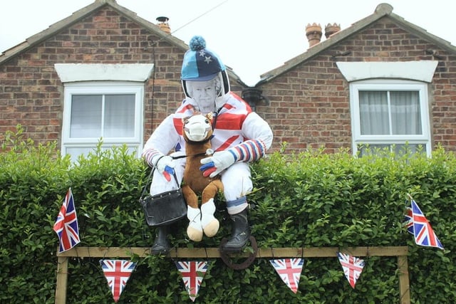 This scarecrow of the Queen jumping a horse was created by Teresa and Richard Wood.