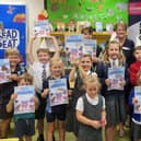 Children who completed the summer reading challenge with their certificates and Woodhall Spa Library Manager Jude Hall.