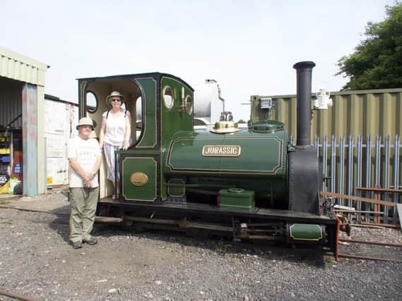 Pam and Roger Biggs on the footplate of the 1903 vintage steam locomotive Jurassic,. Photo: John Raby.