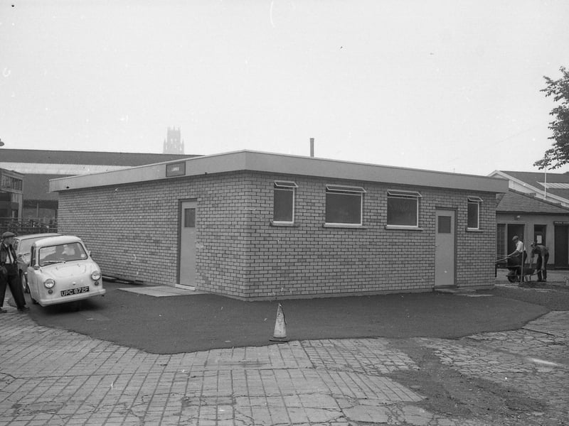 The old toilets in the background, set to be demolished.