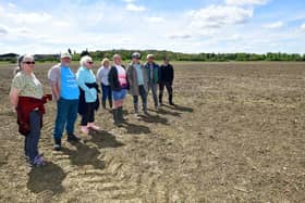 Anwick residents walking along a footpath through the field where the anaerobic digester is planned. Photo: David Dawson