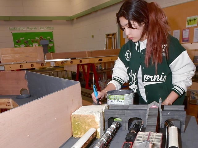 Club member, Diana Bridgman working on decorating her layout. Photo: David Dawson