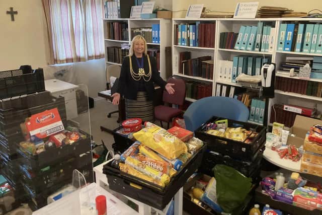 The Mayor of Boston, Coun Anne Dorrian, pictured with some of the food donations for Boston Food Bank.