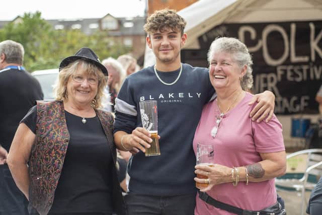 Images from Sleaford's Thank Folk for the Ivy festival. Grandson (Kieran Dyke) and grandmother (Yvette Dyke - right) with friend and member of riverside ukulele band, Helen Quirke (left), enjoying the festival. Photo: Holly Parkinson
