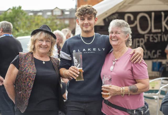 Images from Sleaford's Thank Folk for the Ivy festival. Grandson (Kieran Dyke) and grandmother (Yvette Dyke - right) with friend and member of riverside ukulele band, Helen Quirke (left), enjoying the festival. Photo: Holly Parkinson