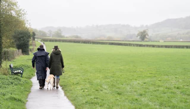 People walk on a footpath near Wells, Somerset. Picture date: Monday November 7, 2022.