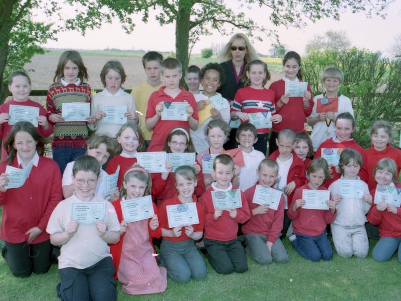 The first of two photos from Amber Hill's Toftstead Primary School, showing pupils with newly acquired swimming certificates.