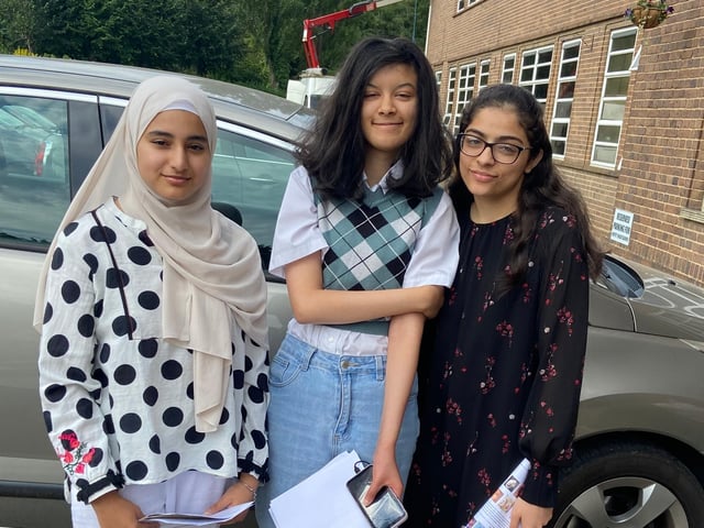 Three more Boston High School pupils collecting their results.