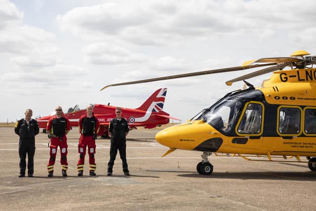 The Air Ambulance photographed with one of the Red Arrows Jets at RAF Scampton.