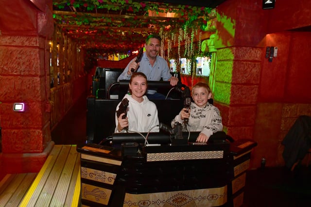 Armed and ready - Fantasy Island owner James Mellors with his children Lacey and Archie who helped design some of the ride's characters.