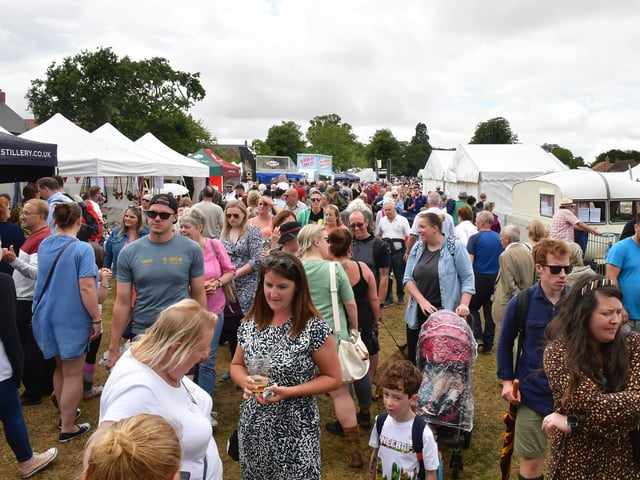 Crowds fill the food area at the show.
