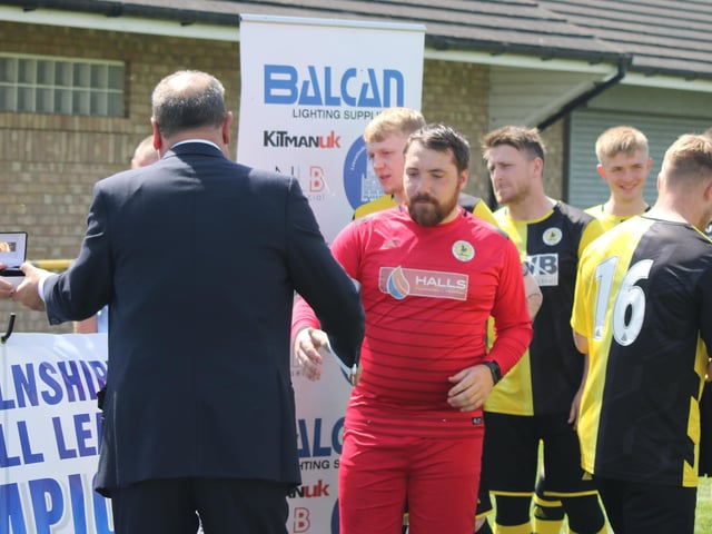 Andy Hewitt collects his medal.