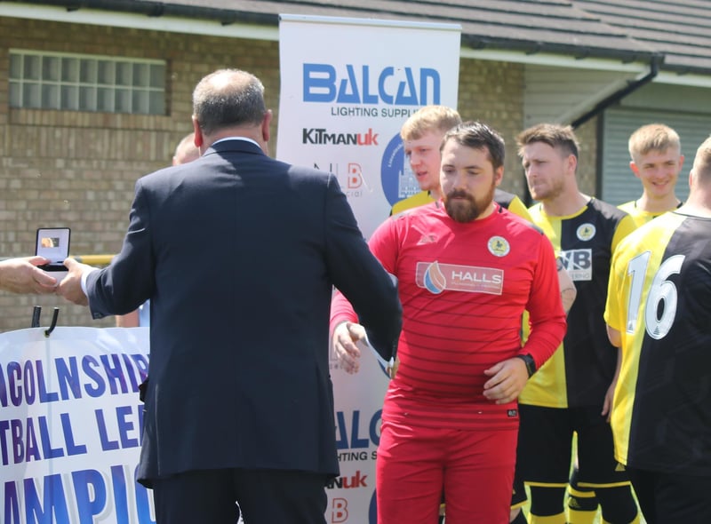 Andy Hewitt collects his medal.