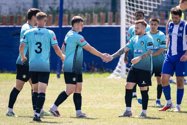 Trinity celebrate a goal at Frickley. Photo by Sean Cook, Foxby Media.