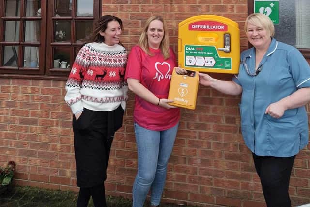 John’s step-daughter Rachel Overton with staff at South Moor Lodge Care Home with one of the new defibrillators