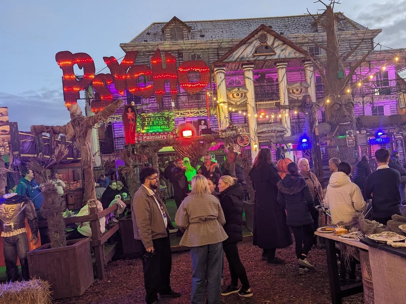 Youtubers, content creators and other VIP guests gather in the central area of Fear Island for some spooky-themed food and refreshments before venturing into the scare zones.