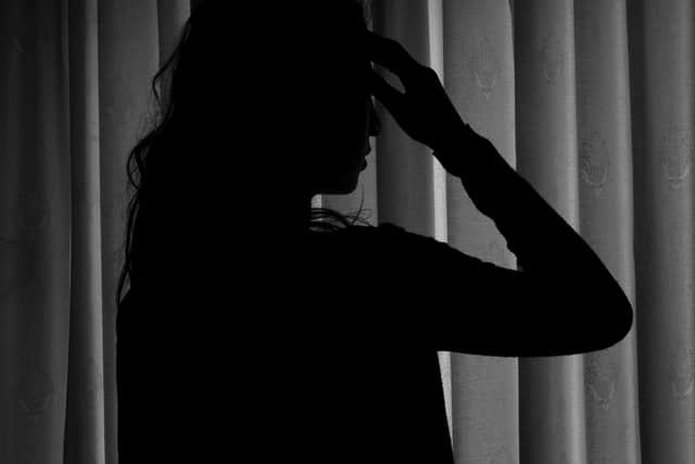PICTURE POSED BY MODEL. A woman showing signs of depression.