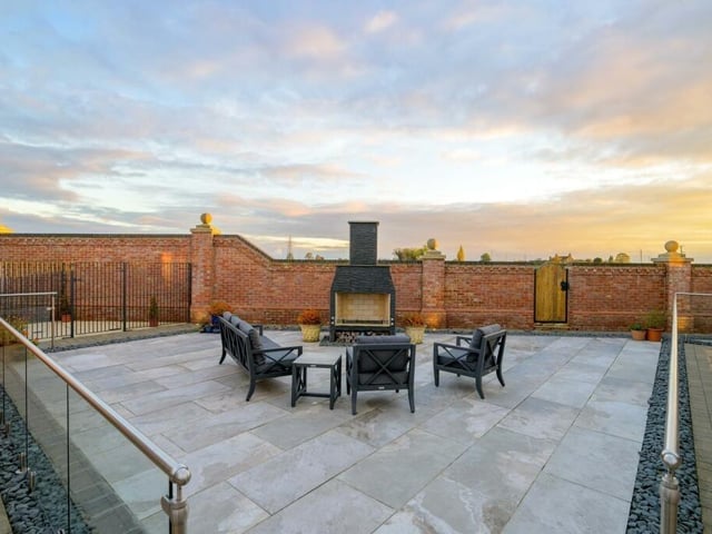 The enclosed outdoor area with fire.