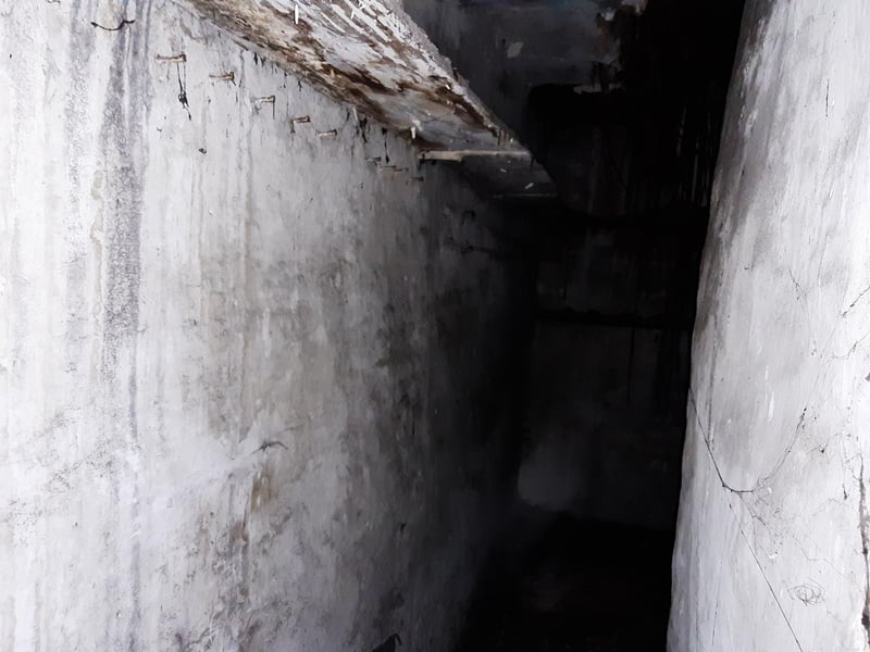 The corridor with hooks on the side.
