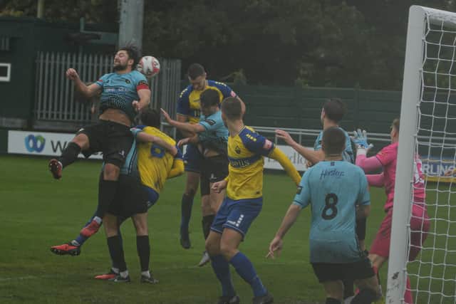 Goalmouth action in the gloom as Trinity win at Warrington. Photo by Jordan Vaughan.