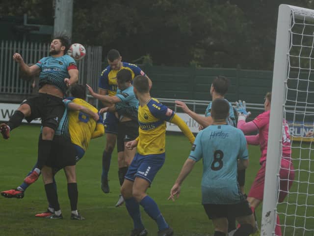 Goalmouth action in the gloom as Trinity win at Warrington. Photo by Jordan Vaughan.