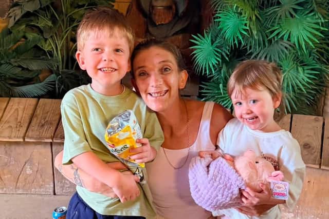 All smiles: Leicestershire mum Sarah and her twins Oliver and Mia pictured on the day.