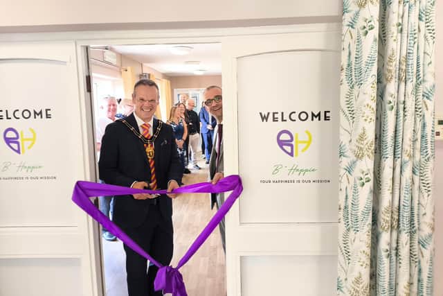 Mayor Darren Hobson cuts the ribbon