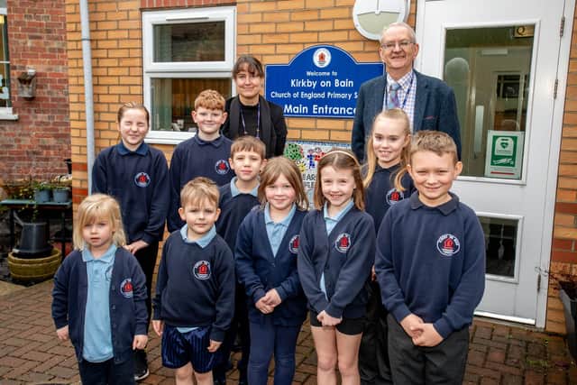 Kirkby-on-Bain primary school headteacher Georgina Day and chair of governors Paul Brewster with pupils.
