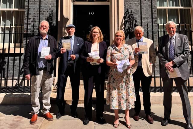 MP Dr Caroline Johnson (centre) with local county and district councillor Marianne Overton and fellow solar farm campaigners outside Number 10 Downing Street. Photo supplied