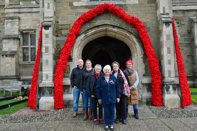 Pictured by the poppy archway at St Wilfrid’s Church, Alford, are (from left)  Ben Stephenson, Laura Stephenson, Doreen Wilson,Ann Lincoln, Rachel Burnett, Sandra Plant