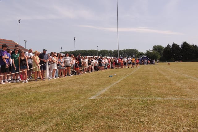 Spectators pause for a minute's silence in memory of Will Ray and Eddie Shore.