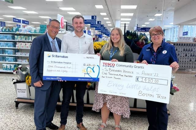 St Barnabas’ Paisely Paddison (third from left) collects the donation.