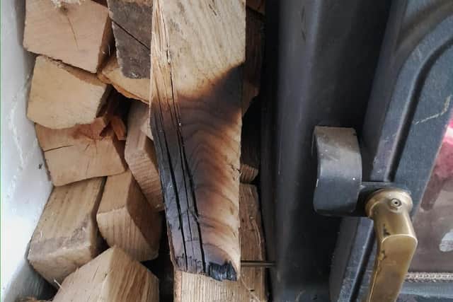 A photo shared by Boston Fire Station following the outbreak in Kirton, showing scorched logs from a burner at a different property, as it made a call for caution in how wood is stored.