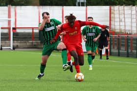 Action from Sleaford's (in red) trip to face Belper on Saturday. Photo: Steve W Davies Photography.