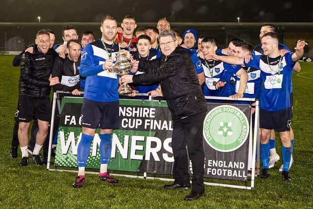 Boston Town lift the Lincs Senior Trophy. Pic Steve W Davies Photography.