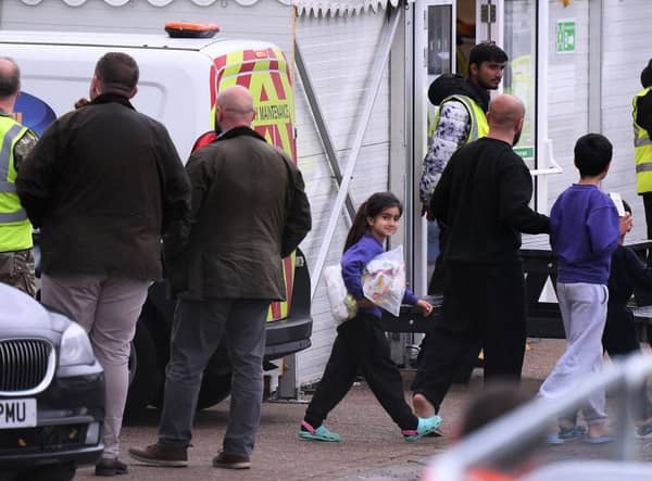 Detainees are seen inside the Manston holding centre for asylum seekers. Immigration minister Robert Jenrick this week vowed "more radical" policies to counter illegal migration.