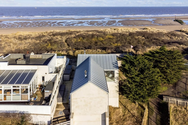 An aerial view showing how close the home is to the beach.