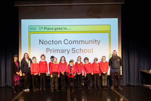 Cllr Patricia Bradwell presents an award to pupils from Nocton Community Primary School