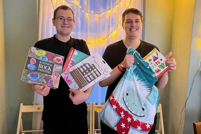 Tom Sanders and Ben Smith of the Neighbour's Kitchen appealing for Christmas gifts.