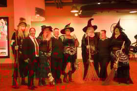 The Boston Dancing Witches, pictured here with Savoy staff, provided entertainment during Wicked's opening weekend in Boston.